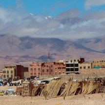 The small town Outat El Haj with the highest mountains of the Middle Atlas in the clouds